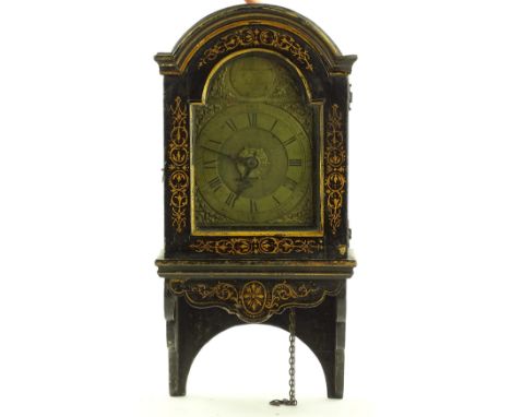 An early 18th century hooded clock, original gilded black lacquer domed top case, containing a 6" arched top brass dial by Ro