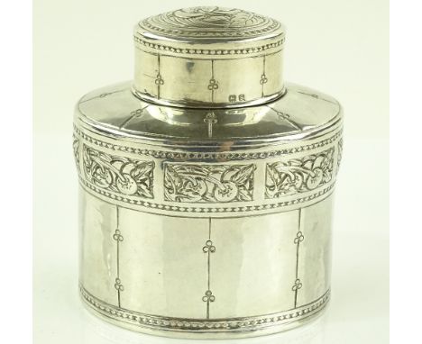 A Liberty Arts & Crafts silver tea caddy of oval form, the frieze having a band of stylised fruit decorated panels, serial no