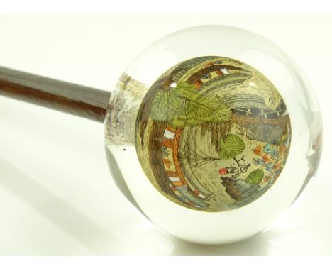 A Chinese glass/crystal handled walking stick, internally painted harbour scene, diameter 7.5cm.