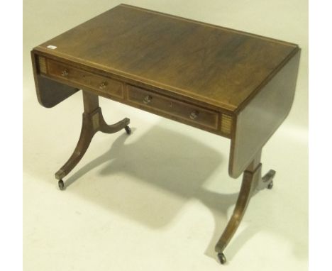 An early 19th century rosewood sofa table, inlaid boxwood crossbanding, 2 frieze drawers raised on sabre legs, 3' x 2'.