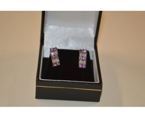 A pair of silver crystal amethyst set ear-rings