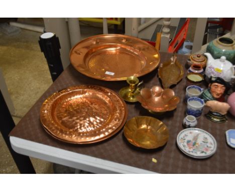 A brass chamber stick and a quantity of copper dishes 