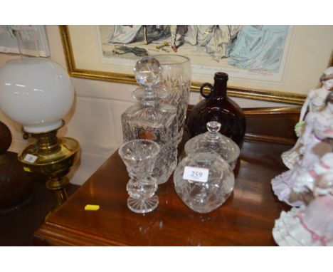 A quantity of glassware to include a decanter and stopper, vases, jar and cover etc.