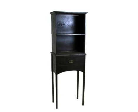 An Arts &amp; Crafts style oak side cabinet with open bookcase above a single frieze drawer on tapering square legs, 46cms wi