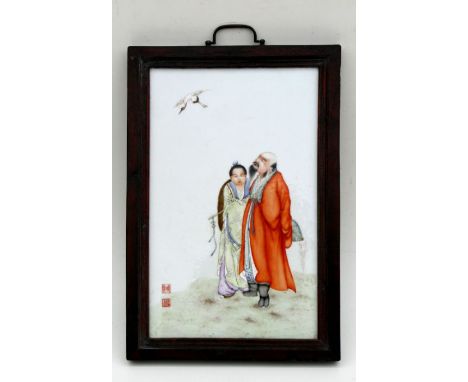 A Chinese Republic rectangular porcelain panel decorated with a pair of robed figures with a crane flying above, red seal mar