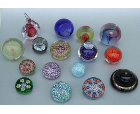 A quantity of Art glass paperweights to include a Murrina millefiori example and two Caithness examples.