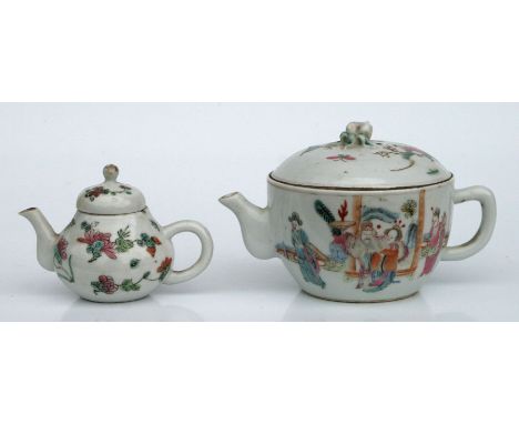 A Chinese famille rose teapot decorated with figures in a court scene and river scene, red seal mark to the underside, 10cms 