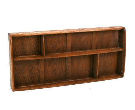 A mid century Ercol Windsor Elm plate rack or shelf unit, 107cms wide.