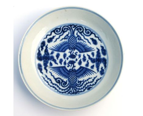 A Chinese blue &amp; white shallow dish decorated with stylised phoenix amongst clouds, blue seal mark to the underside, 17cm