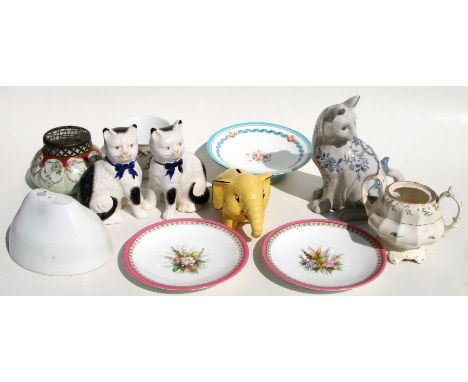 An Arthur Wood elephant form ceramic money box; together with a pair of Staffordshire style cats; and other items.