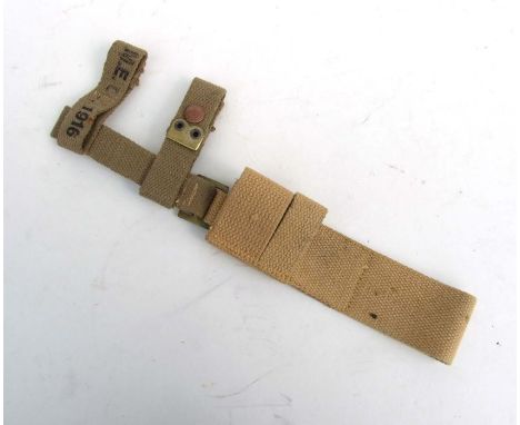 An unissued 08 Pattern bayonet frog with helve strap and carrier. Marked to the reverse of the frog with the War Department a