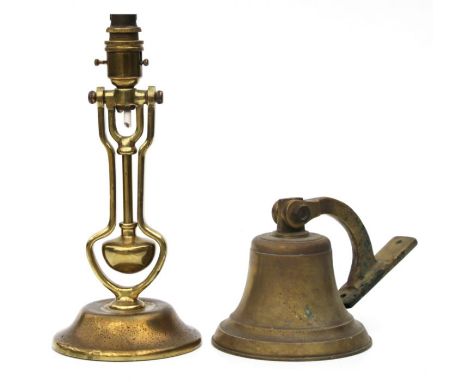 A brass table lamp with gimble column; together with a brass bell (2).