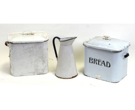 A 1950s vintage white and black enamel lidded bread bin, 33cms wide; together with another similar and an enamel water jug, 3