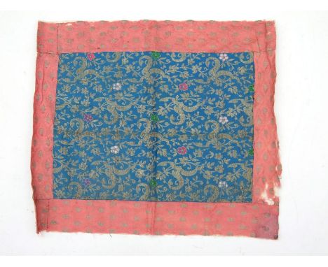 A Persian silk panel decorated with flowers and foliage, 39 by 44cms.