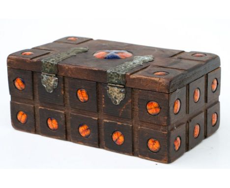 An Arts &amp; Crafts style stained pine box inset with enamel roundels, 28cms wide.