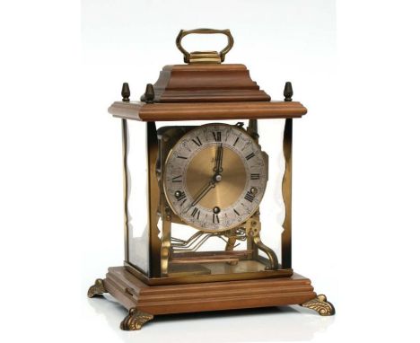 A German mantle clock, the silvered chapter ring with Roman numerals, fitted with a three-train movement striking on eight go