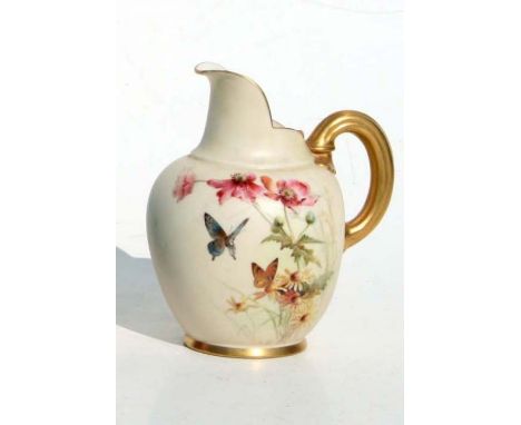 A Royal Worcester blush ivory milk jug decorated with butterflies and foliage, puce mark to the underside, 14cms high.