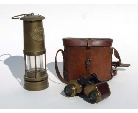 An E Thomas &amp; Williams style brass miner's safety lamp, 25cms high; together with a pair of Crown Optical Co. (USA) brass