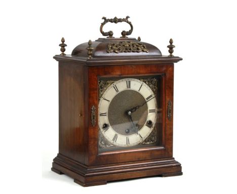 A George III style bracket clock, the silvered chapter ring with Roman numerals and fitted with a three-train movement striki