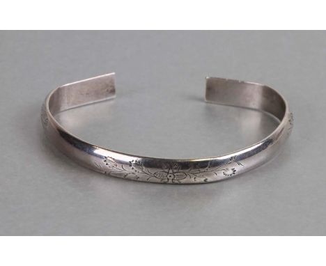 A Chinese silver bangle with floral engraved decoration, weight 37g.