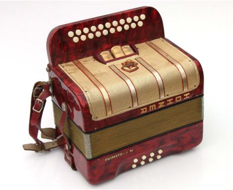 A Hohner Primatona IV accordion.Condition ReportNo evidence of worm, surface scratches in places and the gauze has some minor