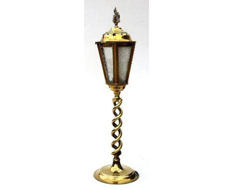 A brass table lamp in the form of a street lamp with an open twist column, 48cms high.