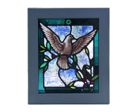 A stained glass panel depicting a bird in flight, framed, the glass 31 by 25cms.Condition ReportGood condition with no cracks