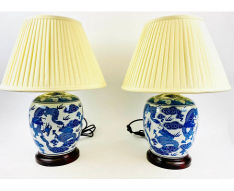 TABLE LAMPS, a pair, 54cm H x 38cm diam, Chinese export style blue and white ceramic, with shades. (2) 