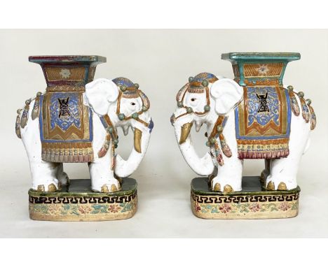 ELEPHANT STOOLS, a pair, 52cm H x 22cm x 47cm, early 20th century Chinese ceramic white, green and blue in ceremonial attire 
