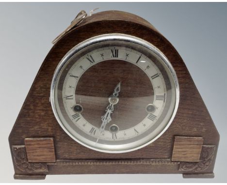 A 1930s oak cased Westminster chime mantel clock, with key.