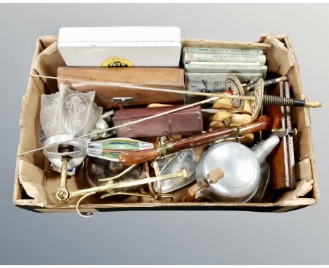 A box of miscellany to include first aid kit, gent's travel set, pair of ornamental fencing swords, Picquot ware teapot, shoe