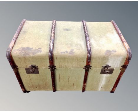 An early 20th century canvas bentwood bound shipping trunk.