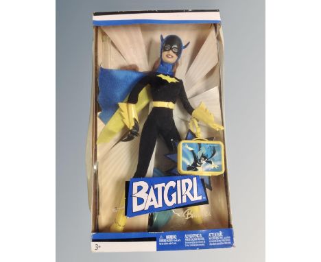 A Mattel Barbie Batgirl figure.