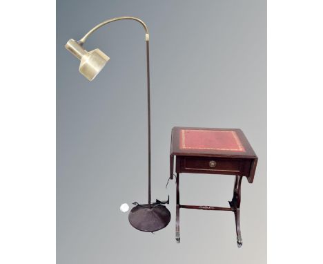 A 20th century angle poise floor lamp and a flap sided sofa table with a leather inset panel.