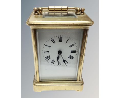 A small heavy brass carriage clock 