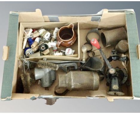 A box of kitchenalia to include mincers, Royal Doulton pottery jug, cutters, ceramic alcohol stoppers 
