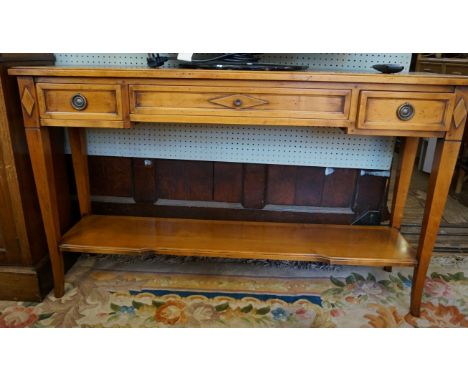 A good quality modern Wesley Barrell yew wood side table, having three single drawers above under tier shelf.