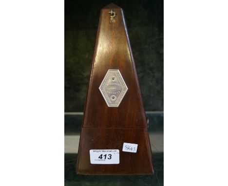 A Maelzel wooden cased metronome.