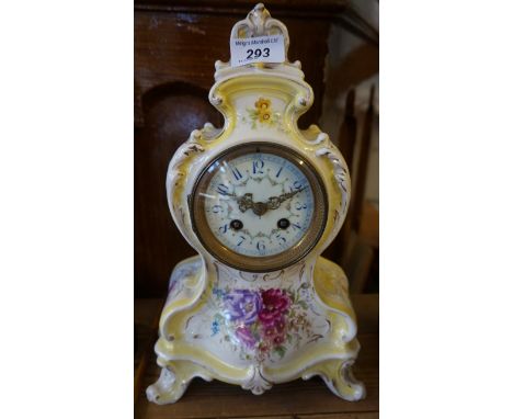 An early 20th Century French ceramic mantel clock with enamel dial.