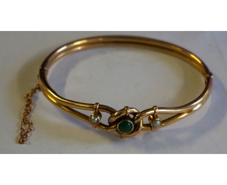 A 15ct gold turquoise and pearl bangle, designed as a knot, with safety chain weight 11g