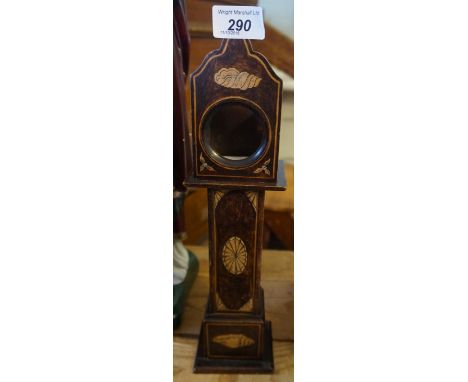 A Edwardian miniature pocket watch holder in the form of a longcase clock.