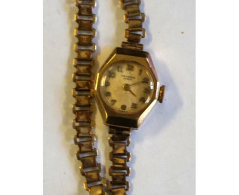 A yellow metal manual wind bracelet wristwatch, to a gilt metal strap