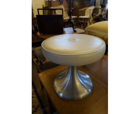 A post war chrome framed dressing table stool with cream leather seat cushion.