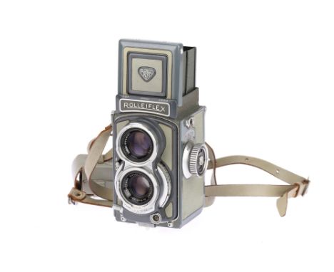 A Rolleiflex Baby Rollei Medium Format TLR Camera, grey, body G-VG, shutter working, optics G, some light haze present,