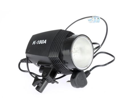 A Godox K-180A Studio Flash Head powers up, flash fires on test button, modelling light working, condition G, remains of prev