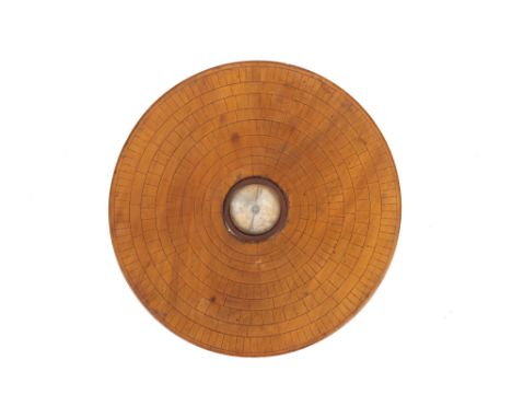 A 19th Century Chinese Geomantic Compass, the compass consisting of a wide thin disk of turned wood with a dry-needle compass