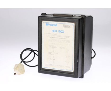 A Polaroid Hot Box Film Drying Mini-Cabinet, black, for bringing Polaroids to the correct temperature for processing, light t
