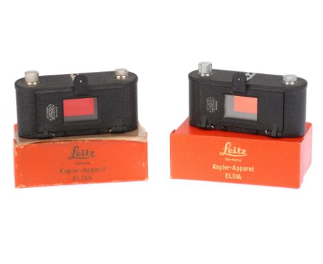 Two Leitz Wetzlar Leica Eldia Printing/Copier Devices with two manufacturer's different-style red boxes