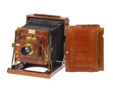 A Sanderson Patent Half Plate Mahogany &amp; Brass Field Camera, body G-VG, bellows G, ground glass G, together with a Busch'