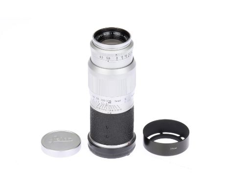 A Leitz Wetzlar Hektor f/4.5 135mm Lens chrome, 1955, serial no.1240219, M-mount, body G-VG, optics F-G, dust, with caps